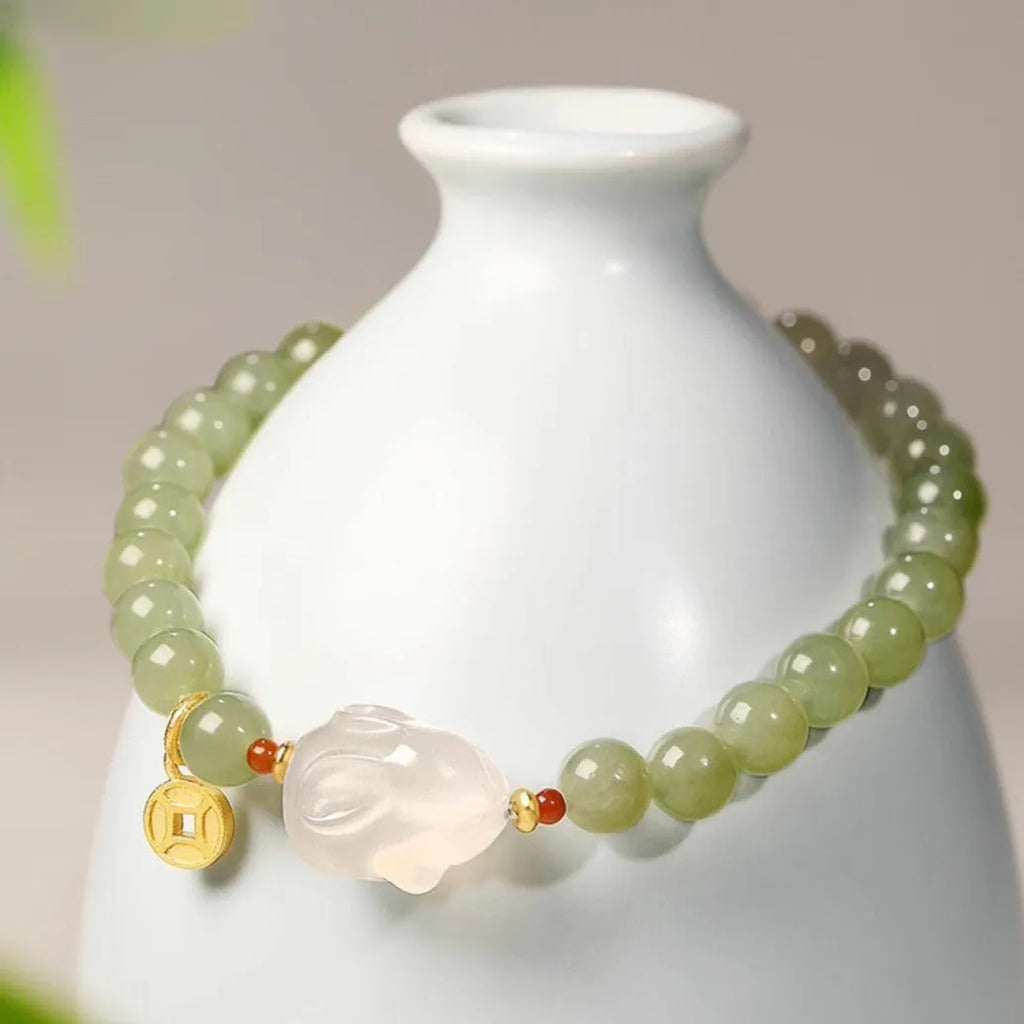 Handmade women's bracelet with a glass band and a choice of rabbit charm, presented in a gift box.