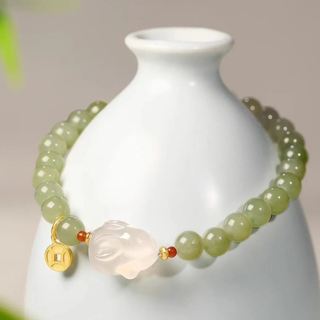 Handmade women's bracelet with a glass band and a choice of rabbit charm, presented in a gift box.