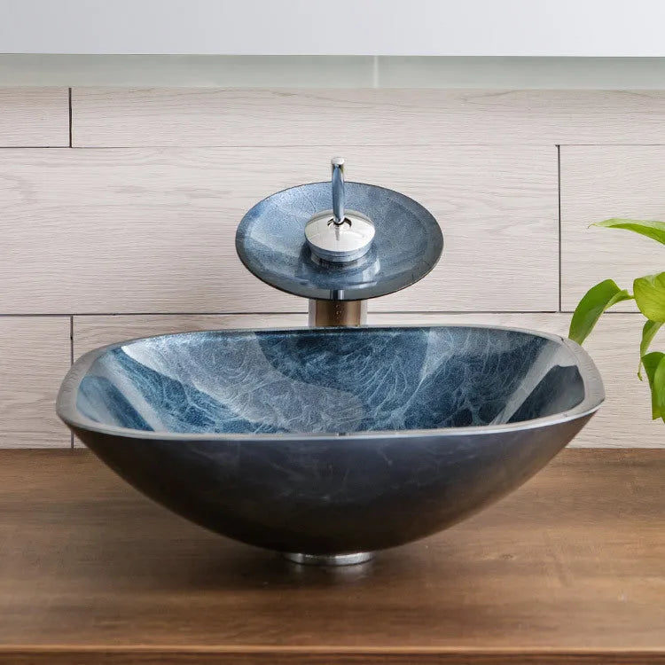 Modern blue-grey tempered glass table basin with a simple design for bathroom vanity units.