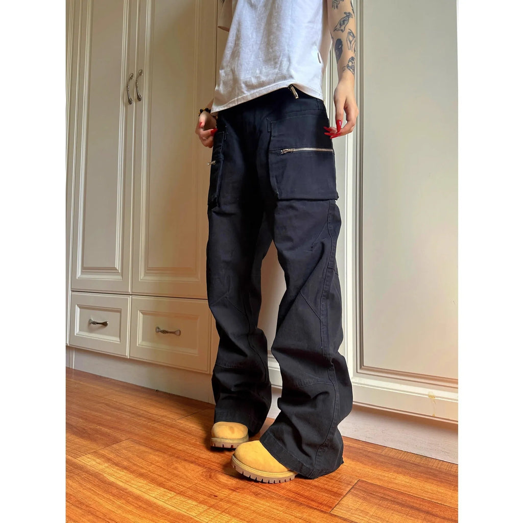 Green and black cotton casual trousers with double zipper detail and pockets on a mid-waist design.