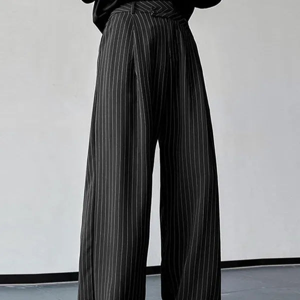 Black men's casual trousers with vertical stripes and front pleats laid flat.
