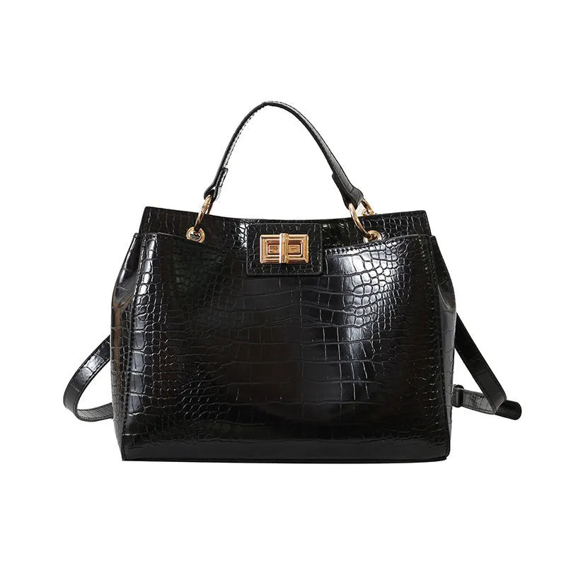 Retro western style messenger bag in black stone pattern with shoulder strap and square vertical shape