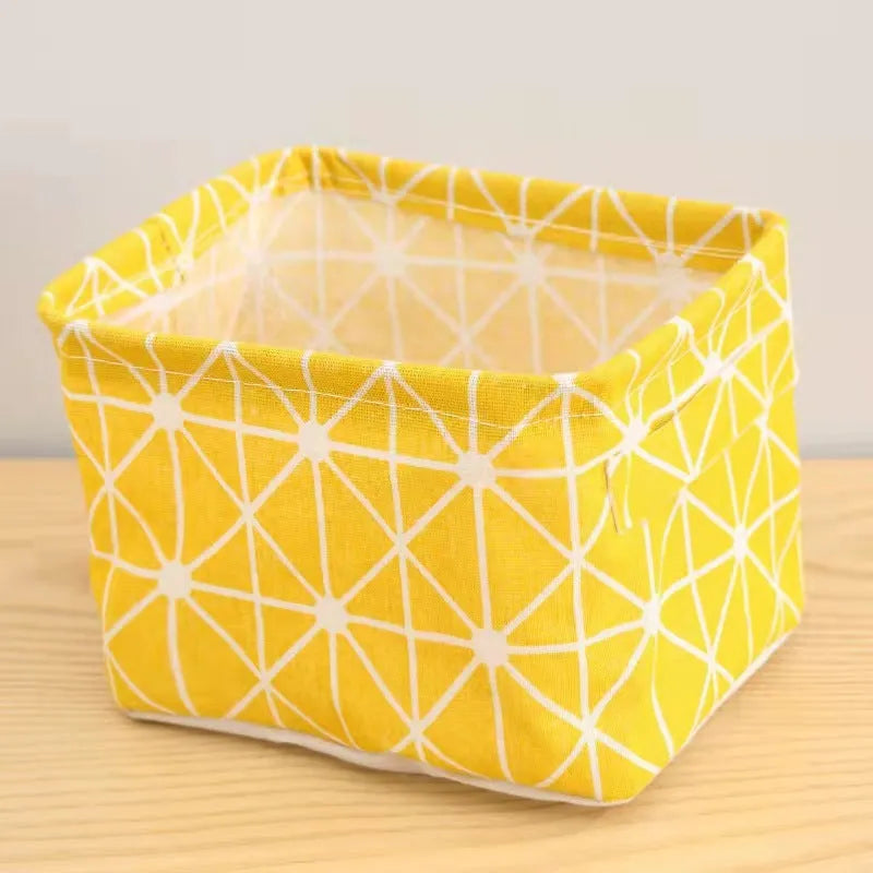 Foldable Oxford cloth desktop storage basket, 20x14x16cm, shown in a patterned pastoral style.