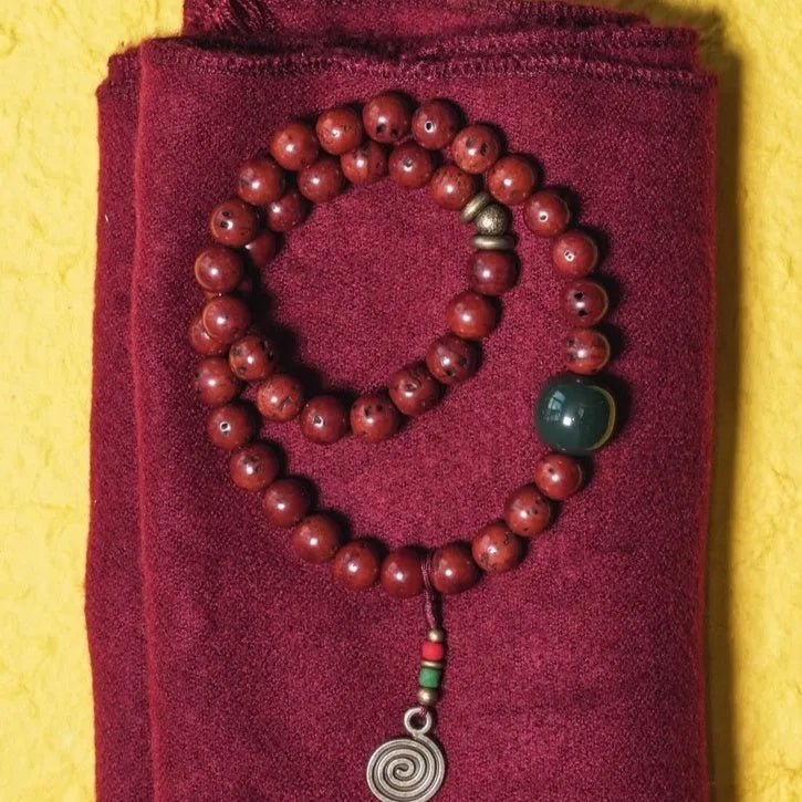 Handmade natural bodhi seed double circle bracelet showing textured seeds and layered design