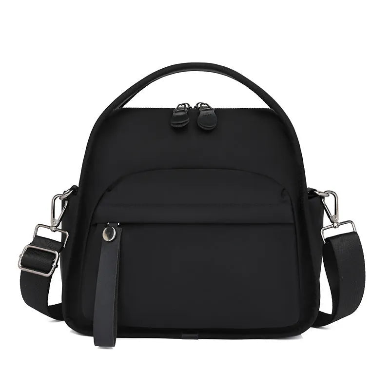 Nylon shoulder bag 25x11x23cm pillow shape with zippered compartment and outer pocket, available in brown, khaki, black, beige