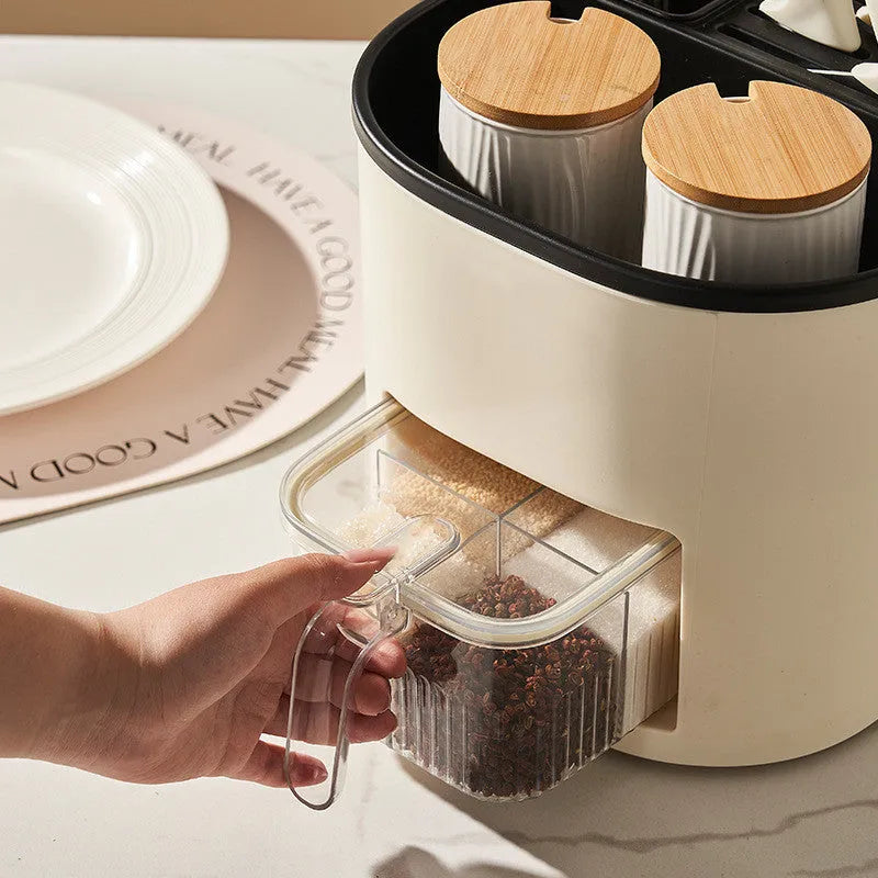 Rotating kitchen storage organiser with four compartments for cutlery and spices