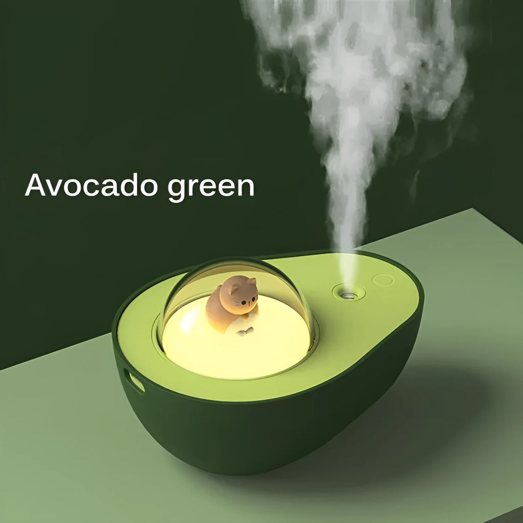 Green avocado-shaped mini USB humidifier with night light on a desk