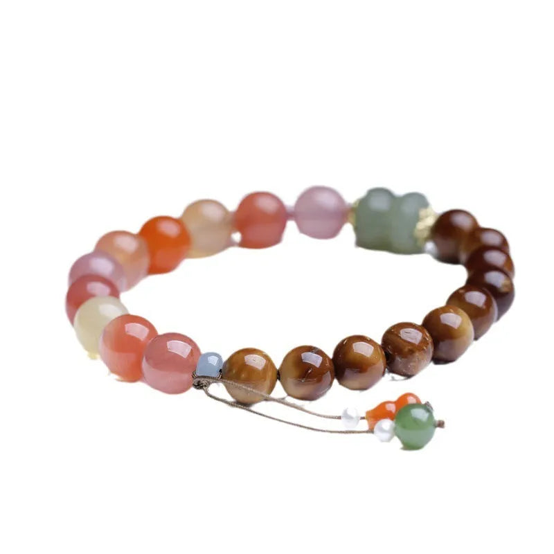 Handmade agate bracelet with 8mm diamond-shaped beads showing natural persimmon colour elements
