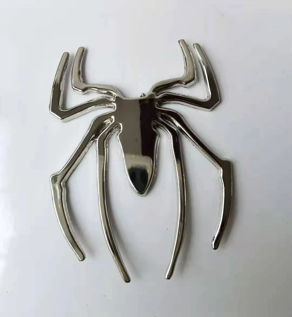 Gold zinc alloy metal bumper sticker with 3D embossed spider design