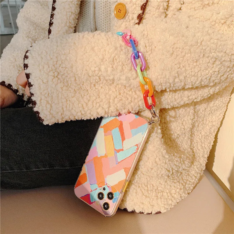 TPU iPhone protective case with integrated bracelet lanyard showing graffiti print design