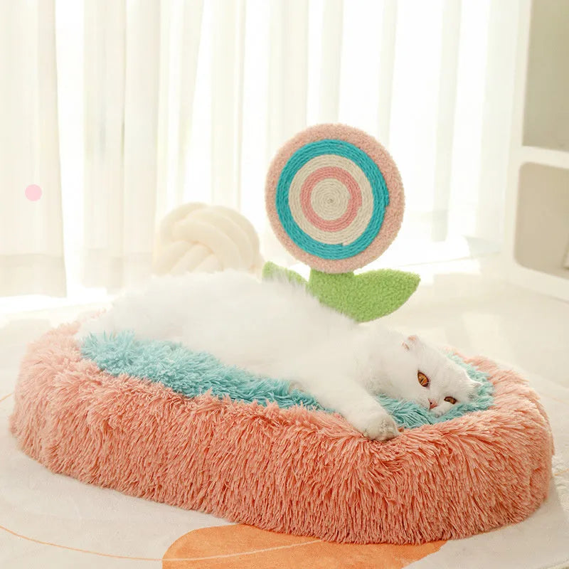 Pink elliptical plush cat bed with removable cover for small to medium cats