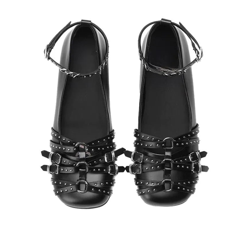 Women's black patent leather retro pumps with a square toe and silver buckle closure on a low rubber sole.