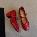 Carved square toe pumps in black with short stout heel, microfiber upper, low top design