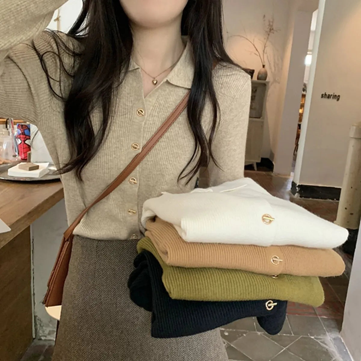 Women's beige knitted cardigan top with long sleeves and loose fit design