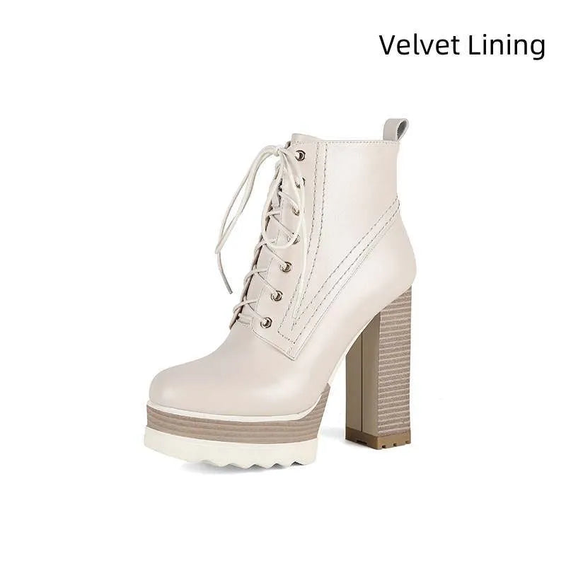 Women's black waterproof platform ankle boots with chunky heel and side zip.