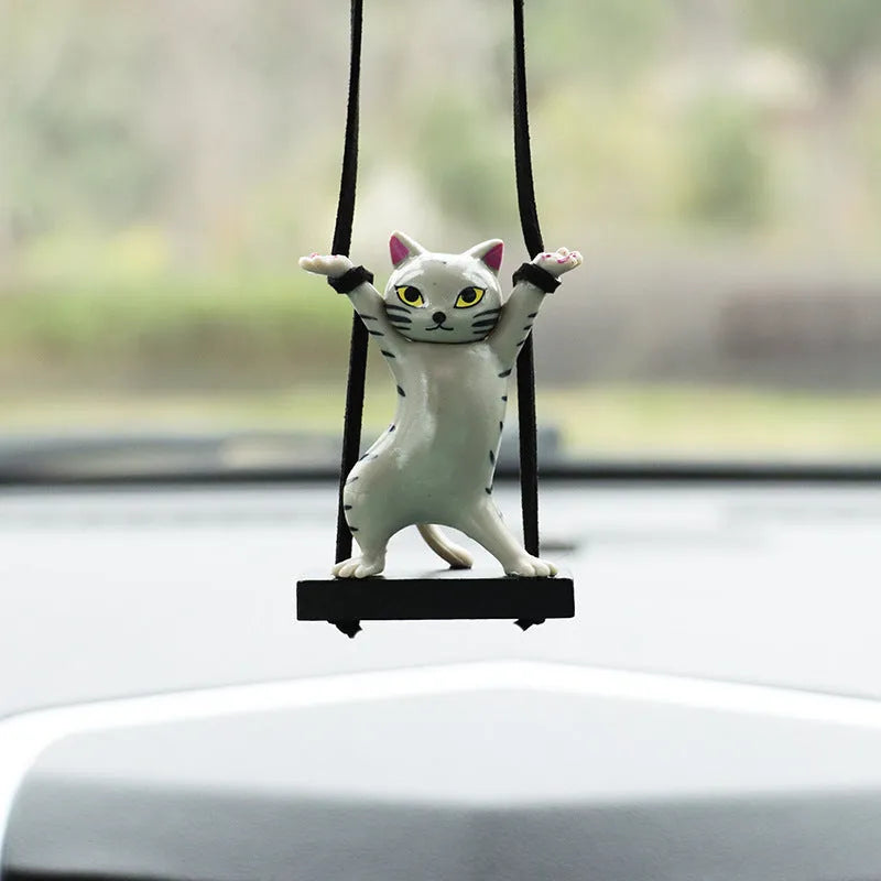Resin cartoon cat pendant for car interior decoration with adjustable rope, shown in various colours.