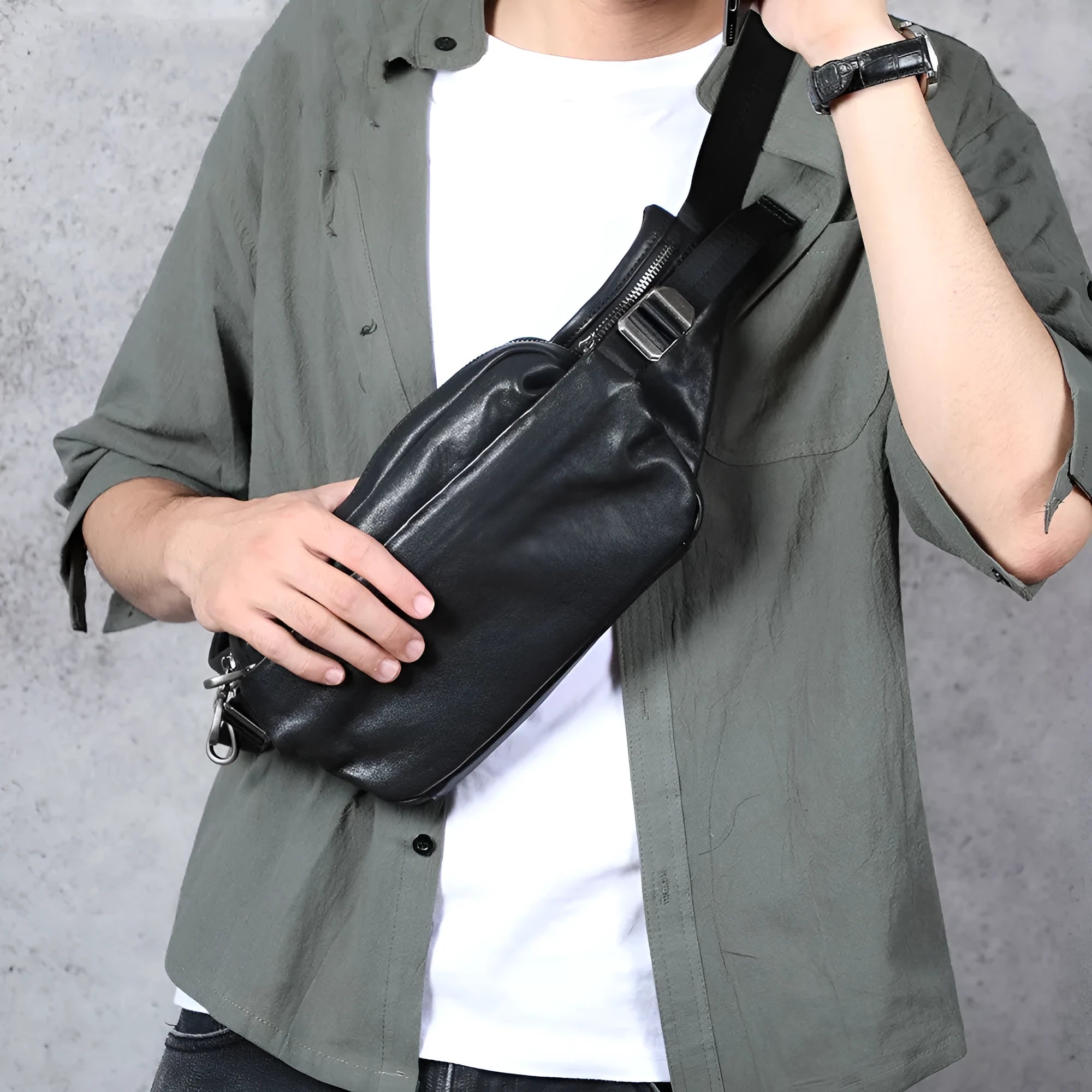 Men's small cowhide cross-body fanny pack in black, horizontal square shape, single shoulder strap