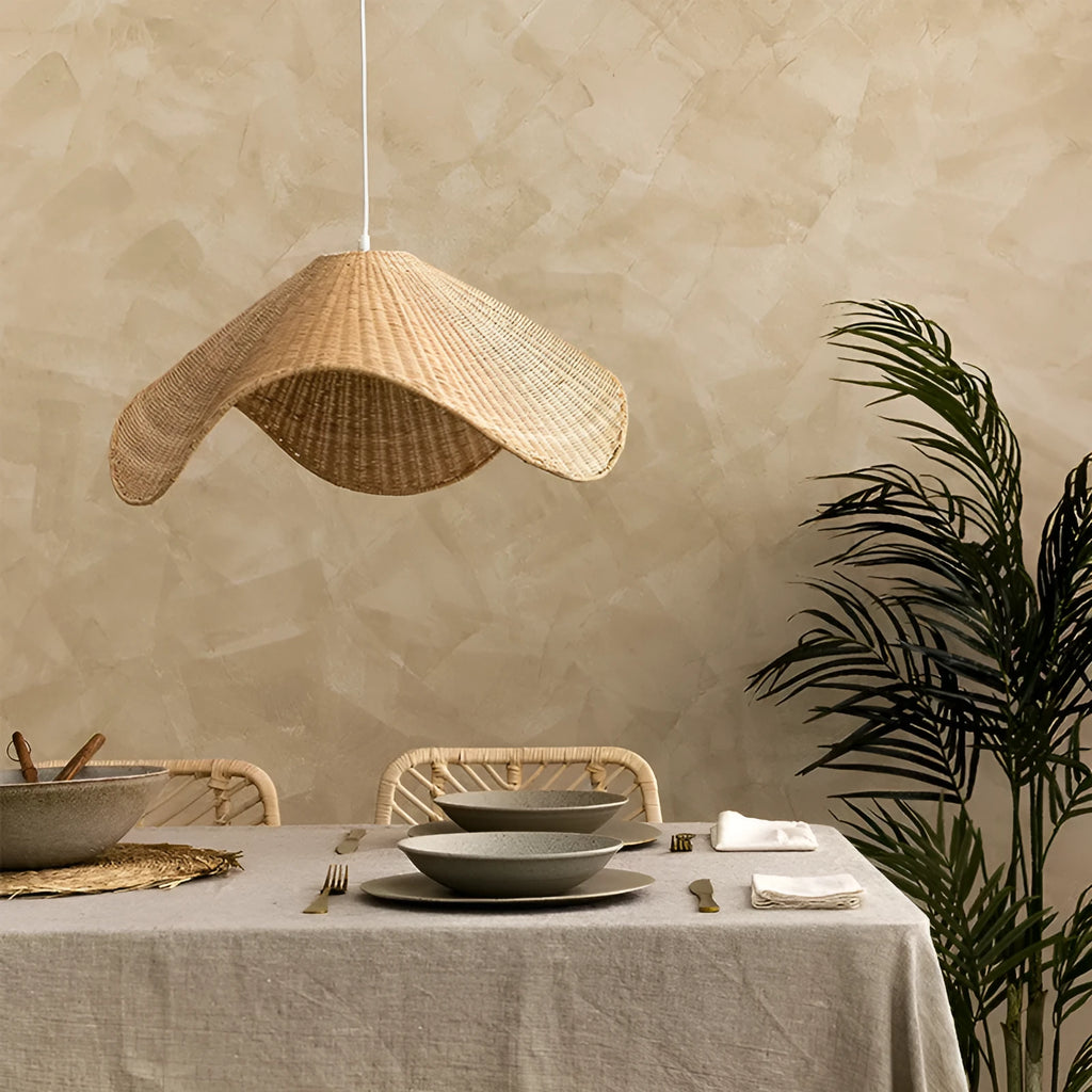 Handmade natural bamboo rattan pendant light chandelier with a woven lampshade emitting a warm glow.