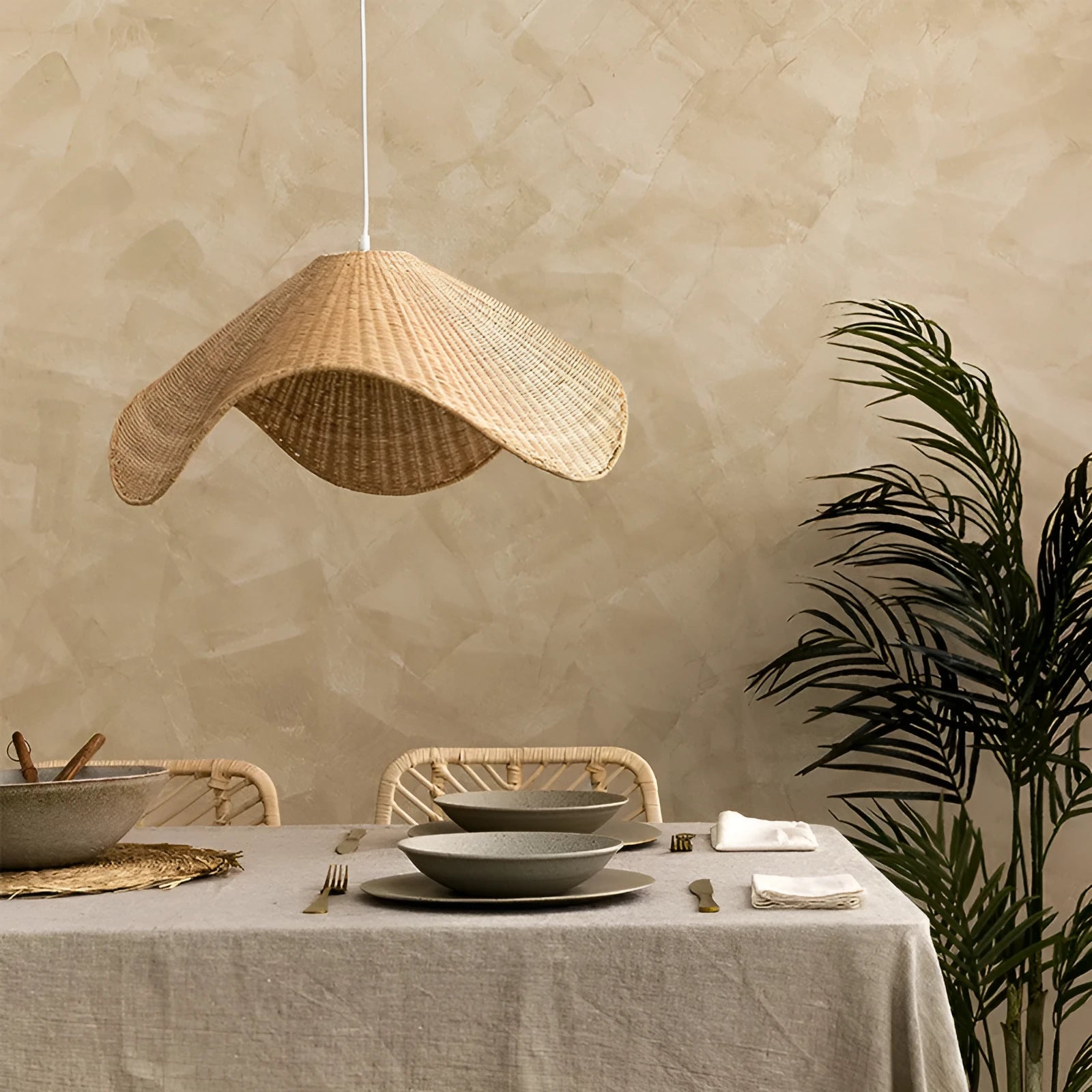 Handmade natural bamboo rattan pendant light chandelier with a woven lampshade emitting a warm glow.
