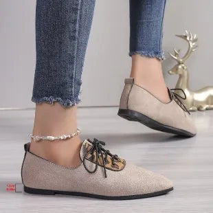 Beige leopard print pointed toe stiletto pumps for women, showing the shoe's side profile.