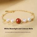 Yellow retro-style bracelet with red cinnabar beads and white pearls on a silver chain.