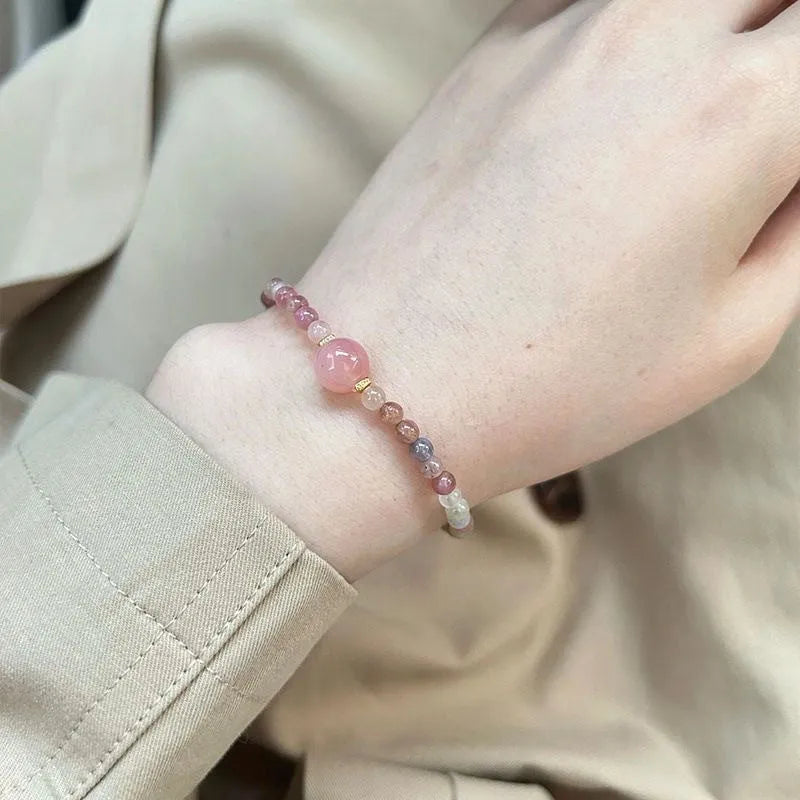 Pink crystal women's alloy bracelet with geometric electroplated charms including mermaid, lily, and cat head designs.