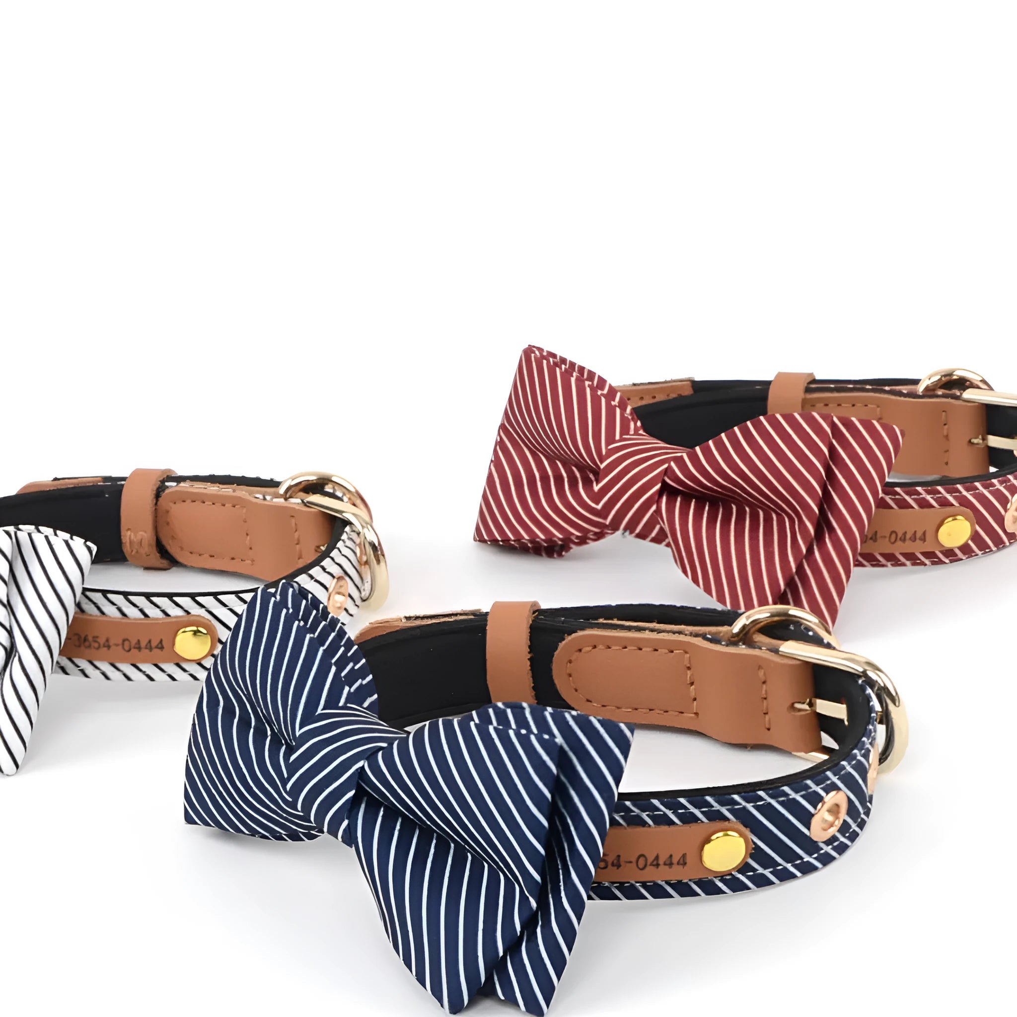 A simple white cotton dog collar with a detachable red bow and leather name tag.