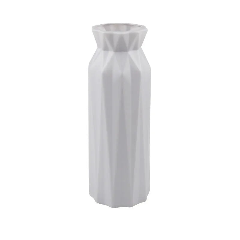 Simple green melamine plastic vase with a 7.2cm base diameter on a wooden table.