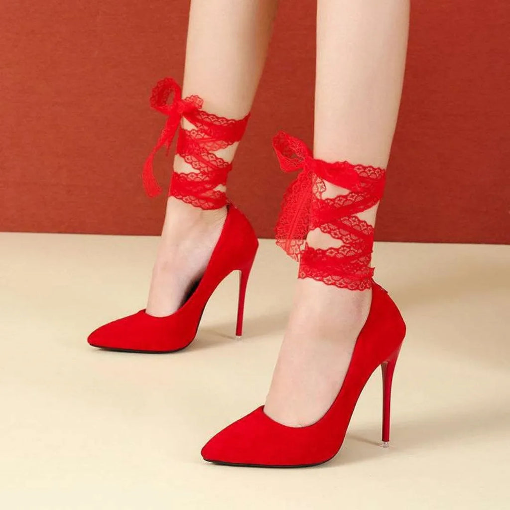 Black pointed toe stiletto shoe with a lace ankle strap and flat buckle on a 12cm heel.