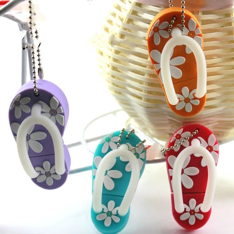 Colourful silicone beach shoe shaped USB flash drive on a white background.