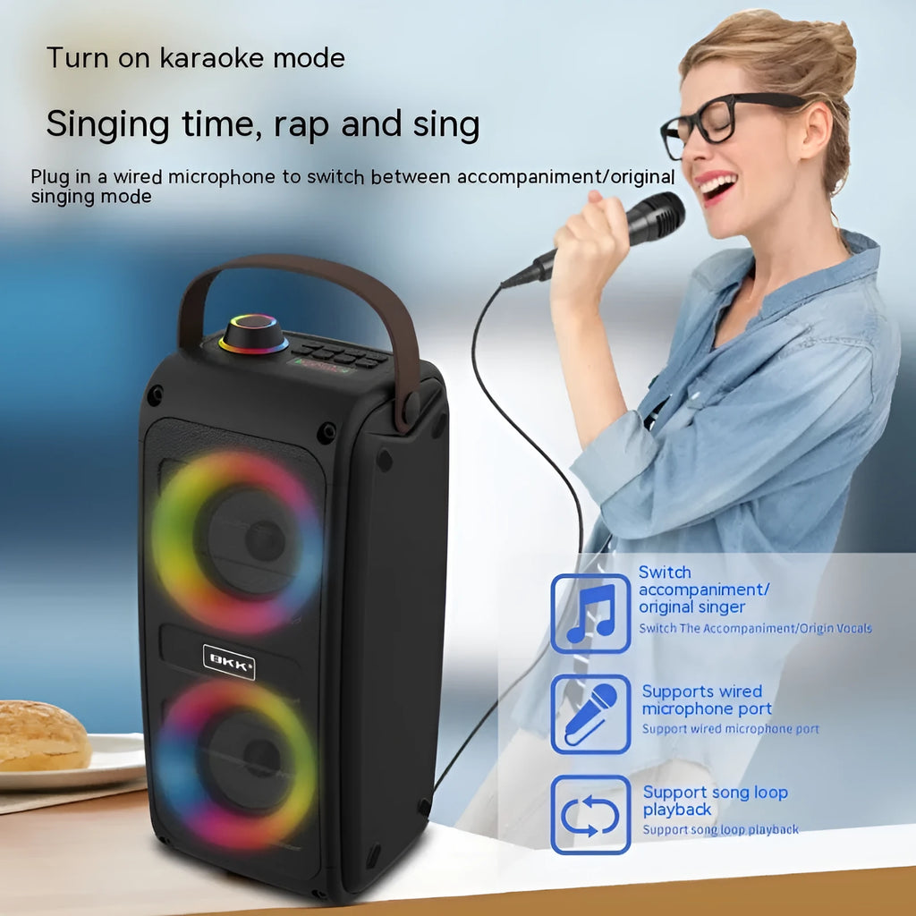 Portable Bluetooth speaker with colour light in black plastic shell, showing built-in speaker grille and button controls.