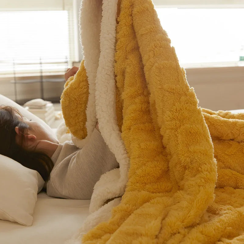 A thick taffeta thermal flannel blanket for winter, shown in one of nine colours on a bed.
