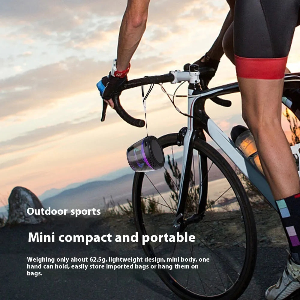 Portable white or black Bluetooth speaker with ambient lighting effects and magnetic mounting