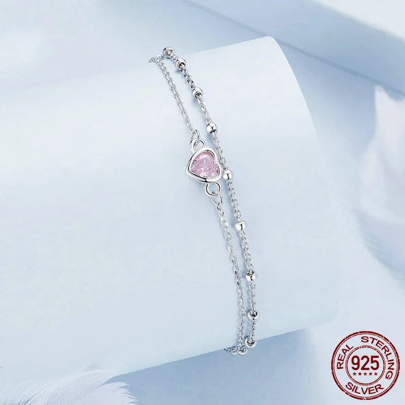 Sterling silver bracelet with heart pendant on adjustable chain