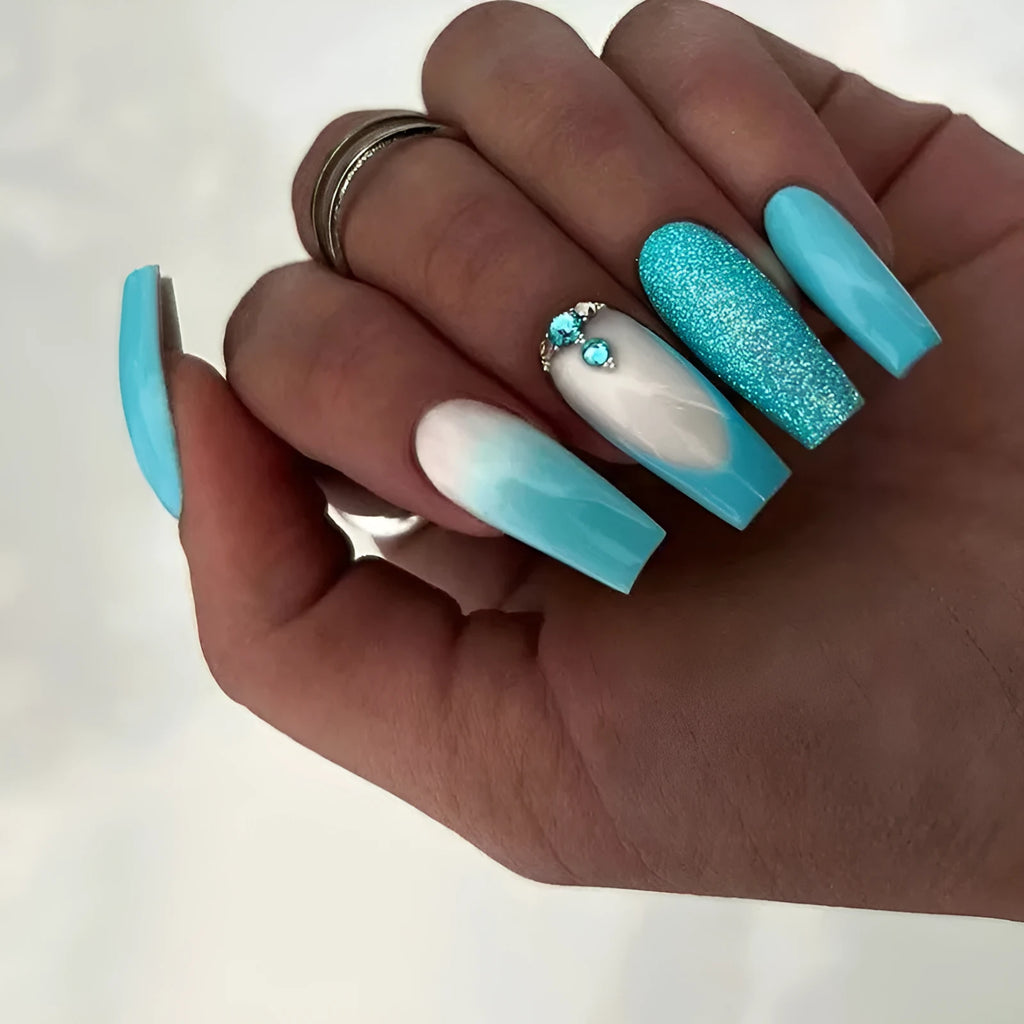 Long ballet-shaped false nails with blue diamond glitter, includes glue.