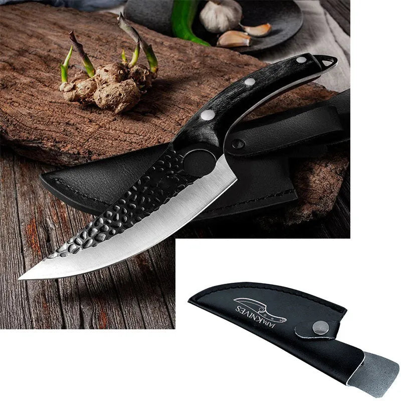 Small scimitar boning knife with hammer pattern finish and black leather sheath on surface