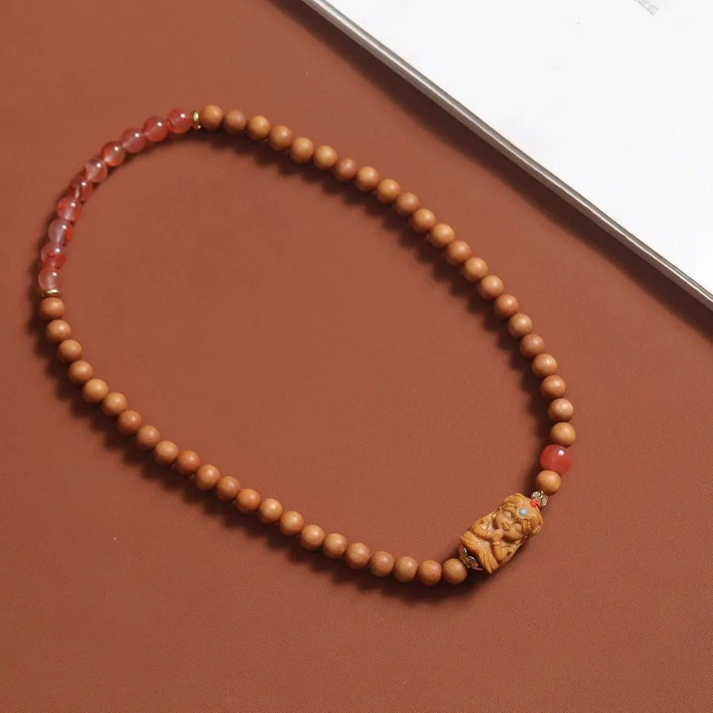 Brown sandalwood bracelet with 6mm round beads in double circle woven design