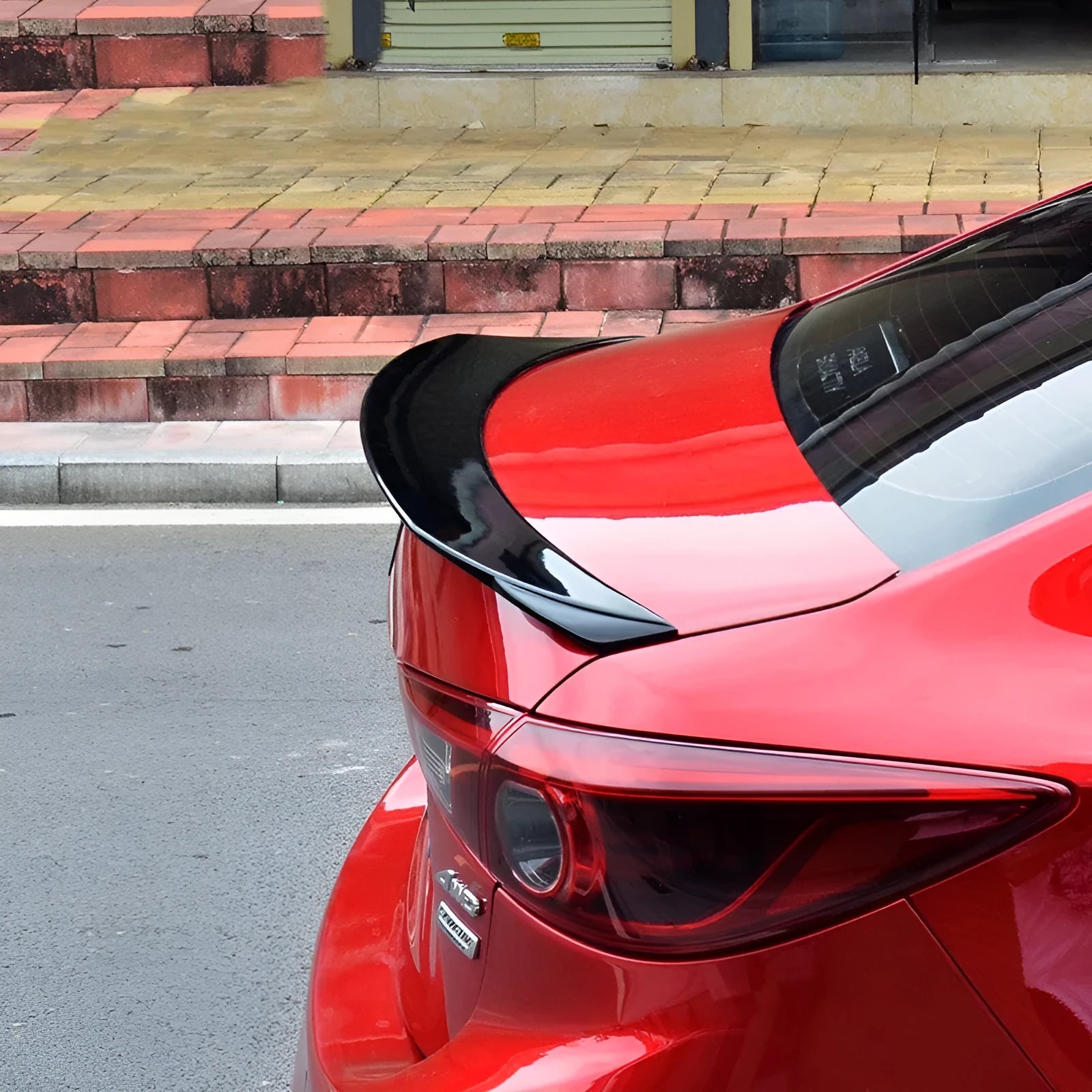 Mazda 3 Axela Exela sports tail blade trim for 2014-2021 models in bright black finish