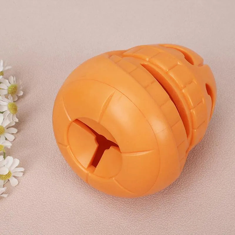 Yellow pumpkin-shaped TPR dog chew toy for aggressive chewers measuring 8.6 x 11.5 cm
