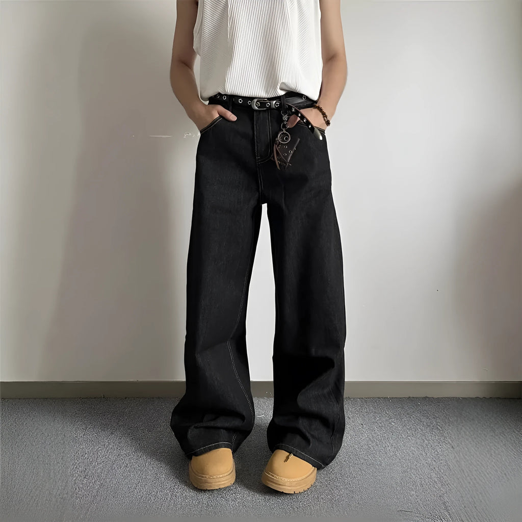 Black retro-style loose-fit straight-leg denim jeans on a hanger.