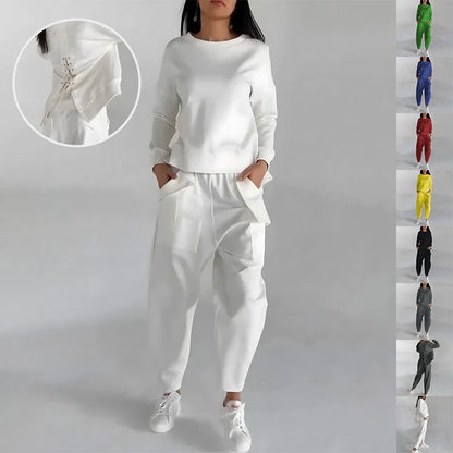 Stylish polyester sweatshirt with unique back slit design and convenient pockets for a fashionable and functional look.