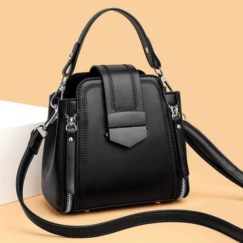 Small square vertical handbag in soft textured PU leather with zip closure and sewing thread detail