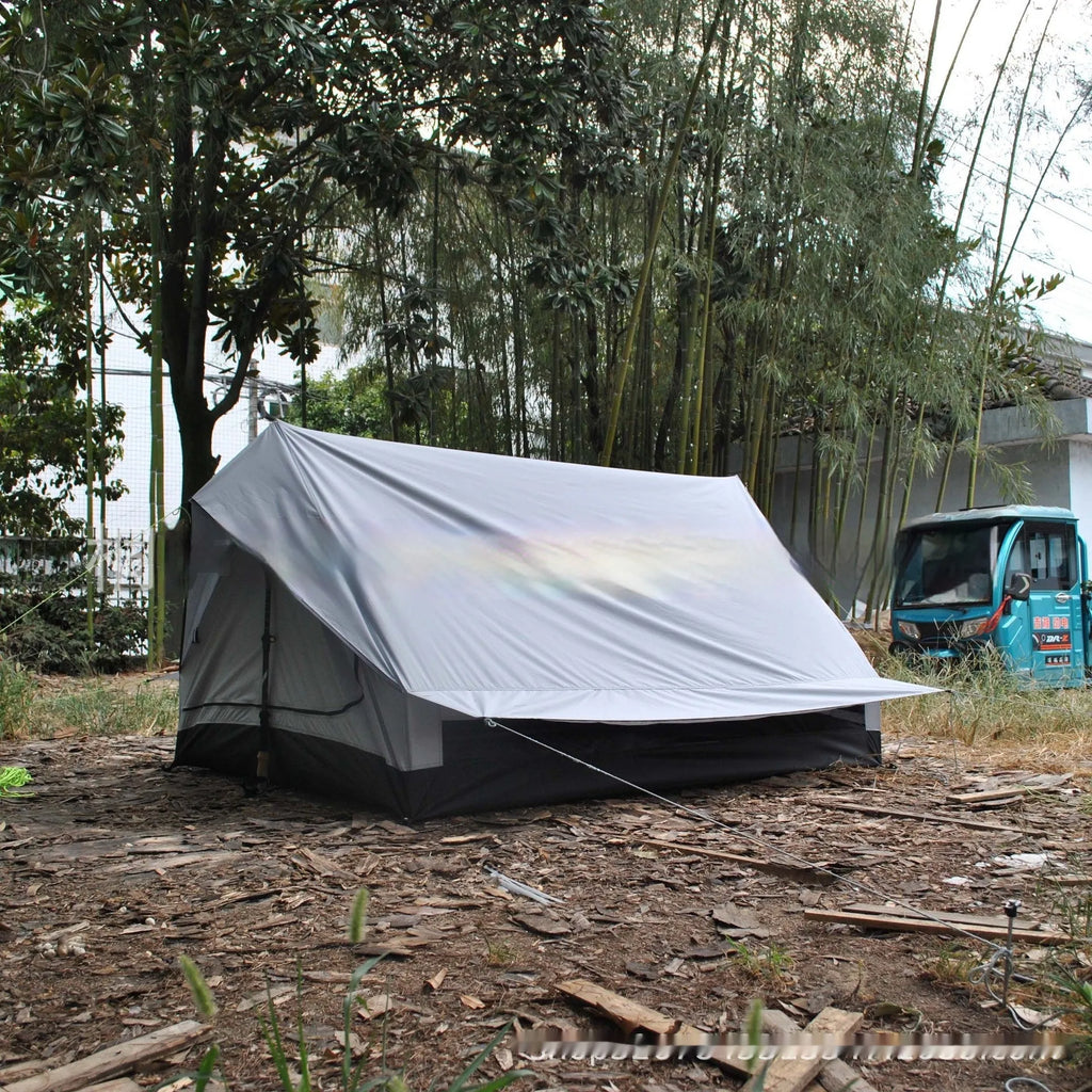 Brown or white A-line pole-free cabin tent for 2-3 people with hiking cane setup.