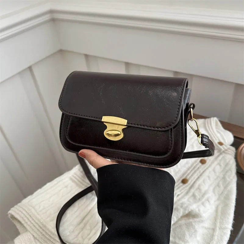Retro small square handbag in soft brown PU leather with horizontal orientation