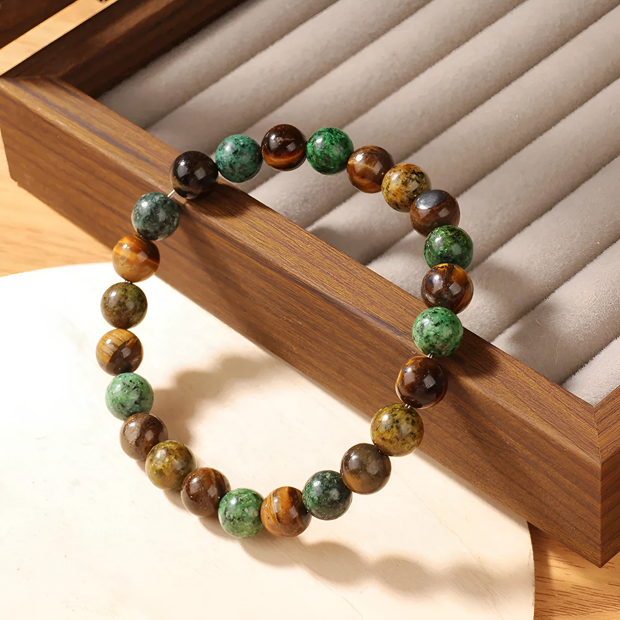 Tigereye stone bracelet with antique flower design measuring 18mm