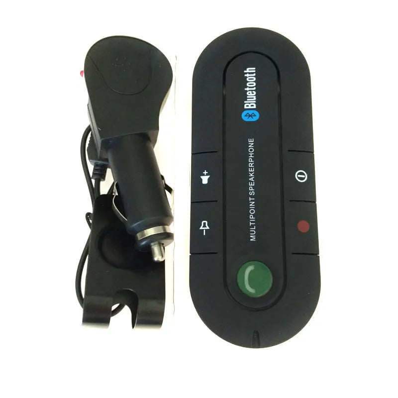 Black vehicle-mounted Bluetooth handsfree unit clipped to a car sun visor, with car charger and cable.