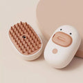 White rechargeable steam brush for cats and dogs with silicone grooming teeth and water tank