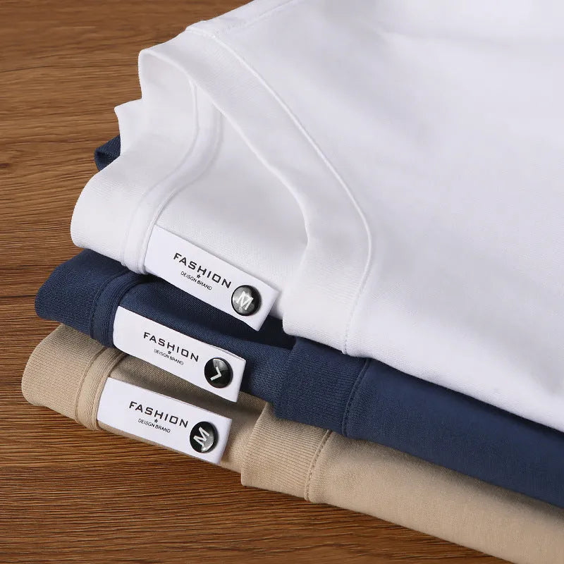 Heavyweight cotton blend T-shirt in drop shoulder design showing loose fit and round neck in multiple colour options