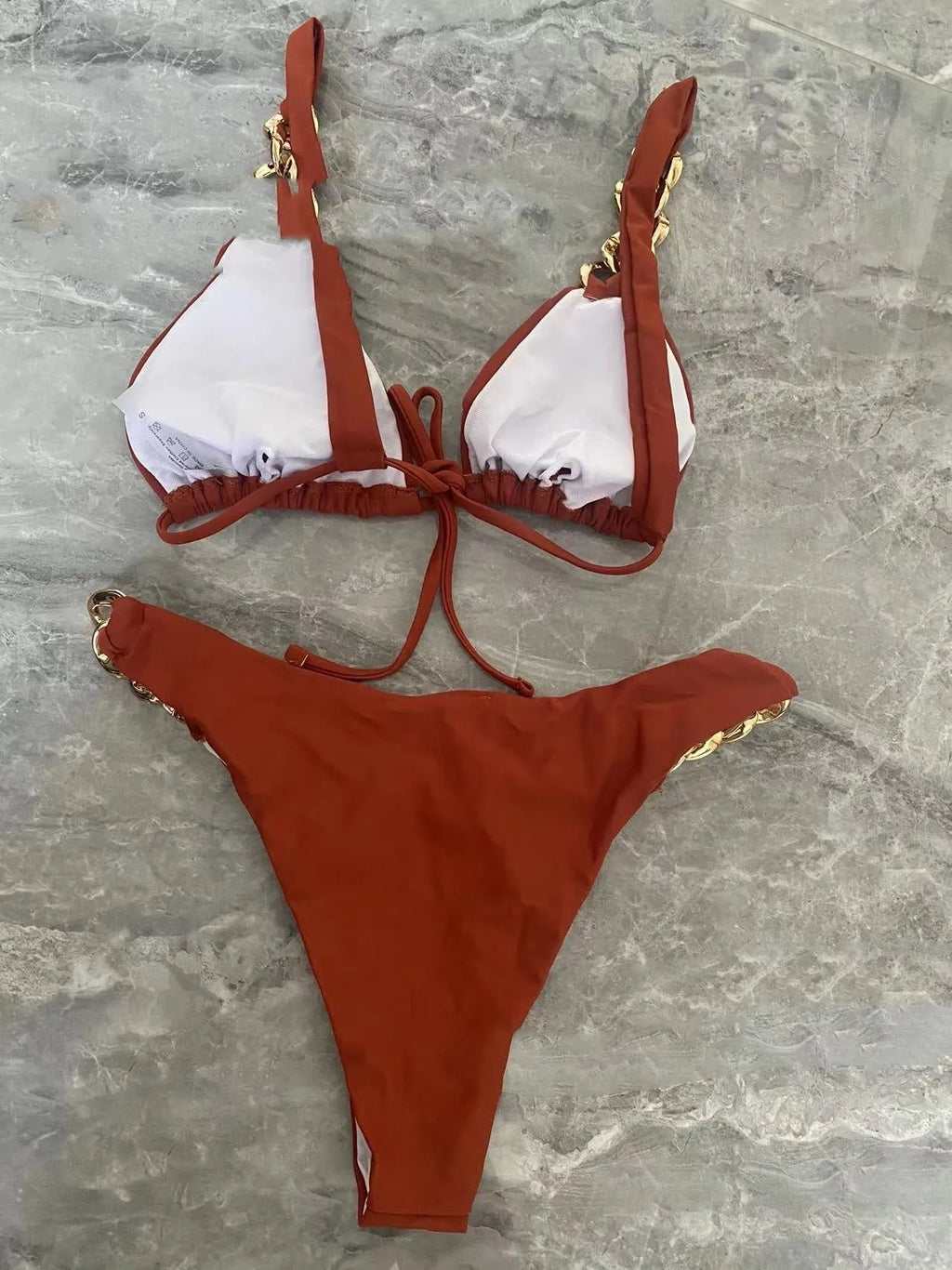 Brown women's tube-top bikini with an adjustable ring-tether halter neck.