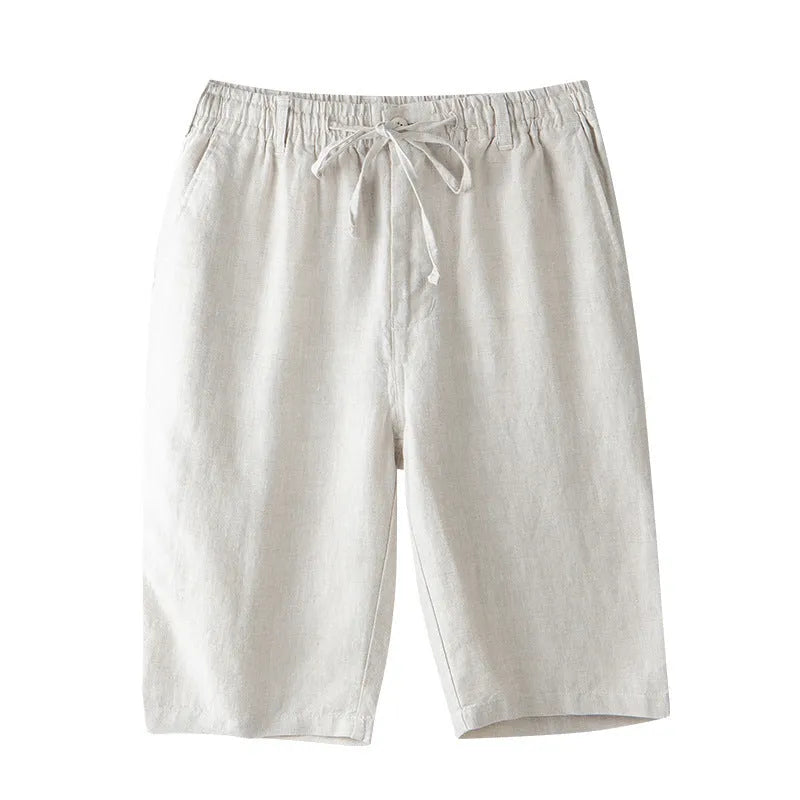 Men's light grey linen trousers with a loose straight-leg fit on a plain background.